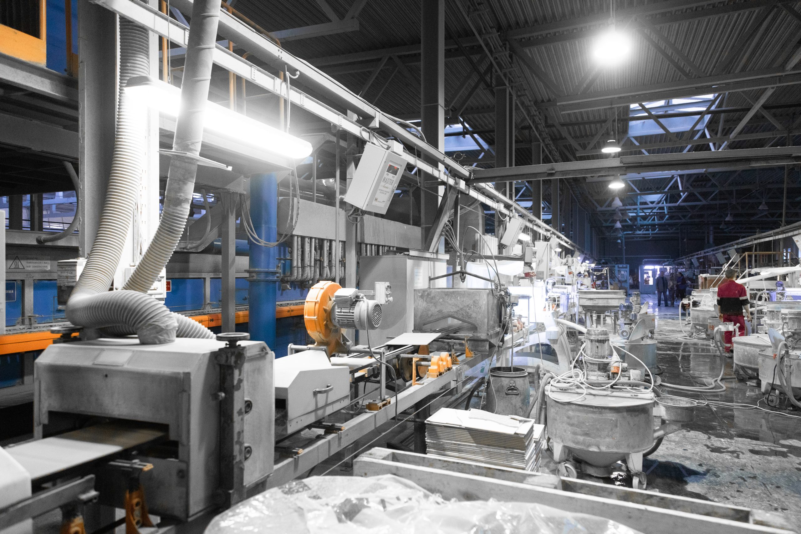 Workers perform their tasks in the shop production plant